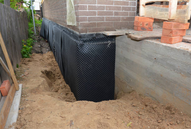 SJ Waterproofing Pros technician performing targeted Interior Drainage System assessment in Chase, PA